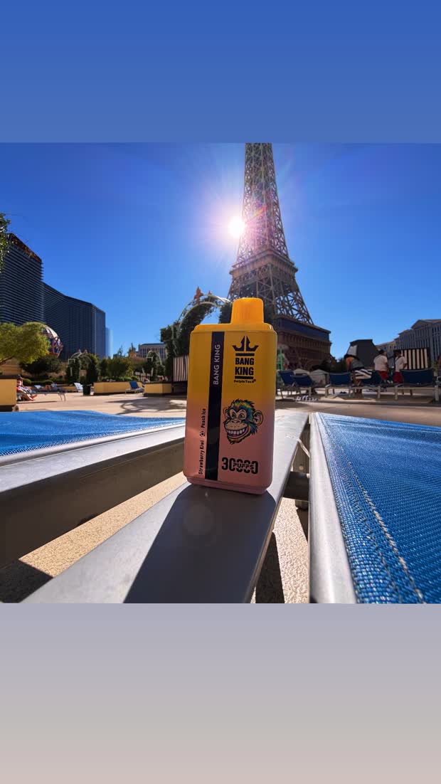 A device on a poolside rail in bright sun